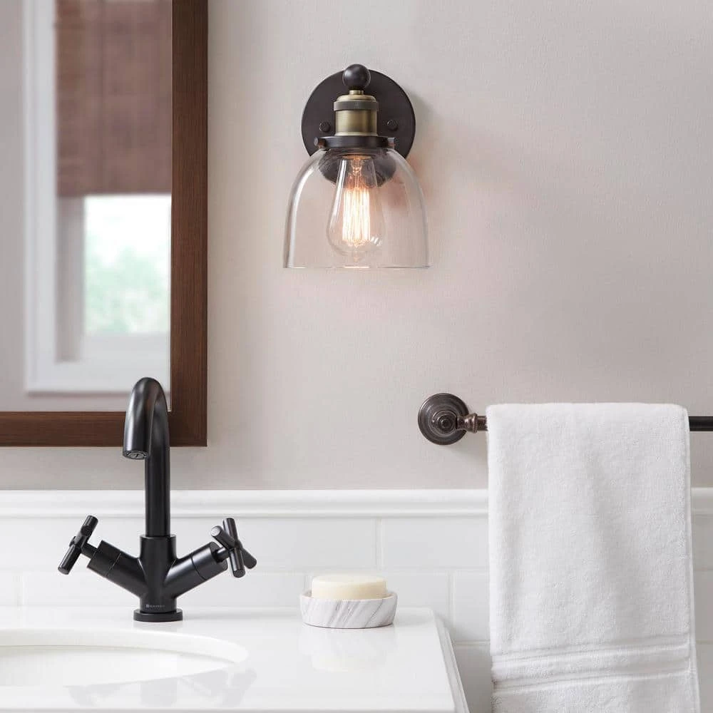 Home Decorators Collection Evelyn 6 in. 1-Light Bronze Modern Industrial Wall Mount Sconce Light with Clear Glass Shade 4 Home Decorators Collection Evelyn 6 in. 1-Light Bronze Modern Industrial Wall Mount Sconce Light with Clear Glass Shade - Image 2