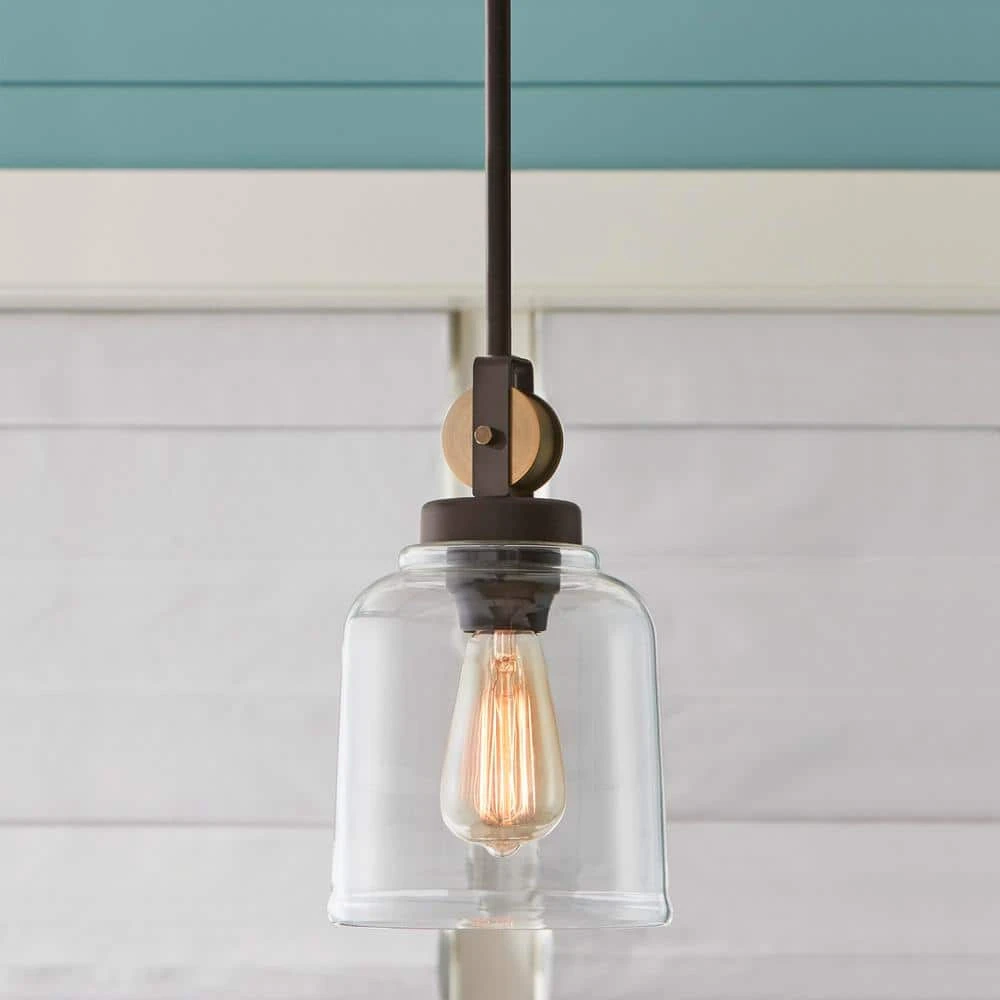 Home Decorators Collection Knollwood 7 in. 1-Light Blackened Bronze Industrial Mini Pendant Light with Vintage Brass Accents & Clear Glass Shade 4 Home Decorators Collection Knollwood 7 in. 1-Light Blackened Bronze Industrial Mini Pendant Light with Vintage Brass Accents & Clear Glass Shade - Image 2