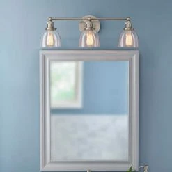 Home Decorators Collection Evelyn 26.75 in. 3-Light Brushed Nickel Modern Industrial Bathroom Vanity Light with Clear Glass Shades -Flora Home Decorators Soldes brushed nickel with clear glass home decorators collection vanity lighting hb2586 35 e1 1000
