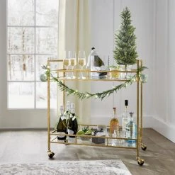 Home Decorators Collection Gold Leaf Metal and Glass Rolling Bar Cart with Glass Top (30 in. W x 33 in. H) -Flora Home Decorators Soldes gold leaf home decorators collection bar carts v174814 np 44 1000
